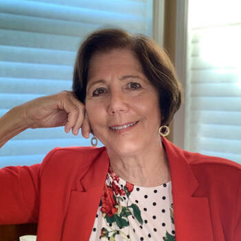 Kathleen Vallee Stein wearing a red top